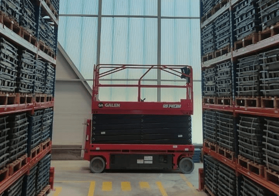 Electric scissor lift used for data center cooling system maintenance