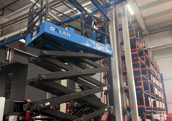 Electric scissor lift for factory maintenance and industrial facility access