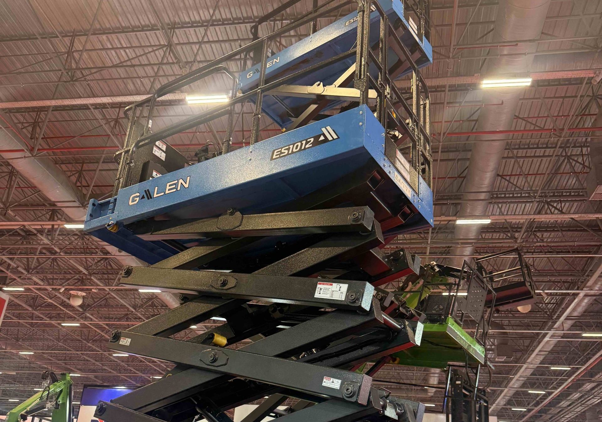 Electric scissor lift used for exhibition hall maintenance and event venue operations