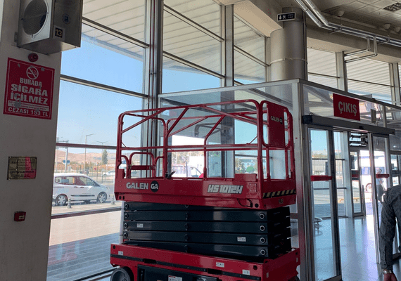 Electric scissor lift for hotel maintenance and facility management