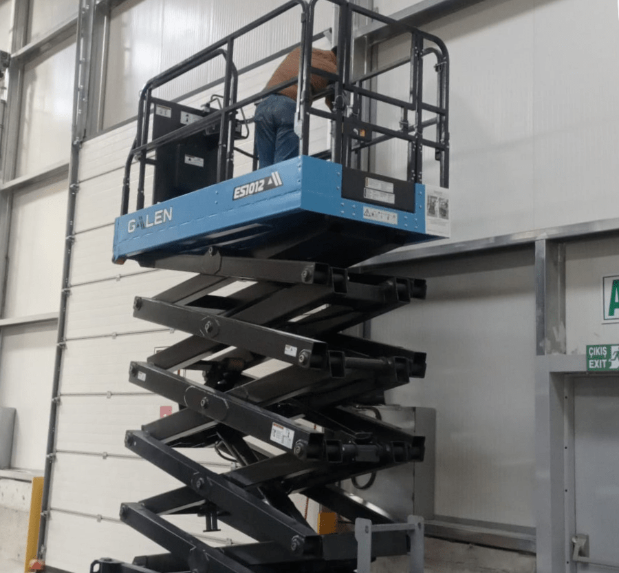 Electric scissor lift used for elevated work and facility maintenance